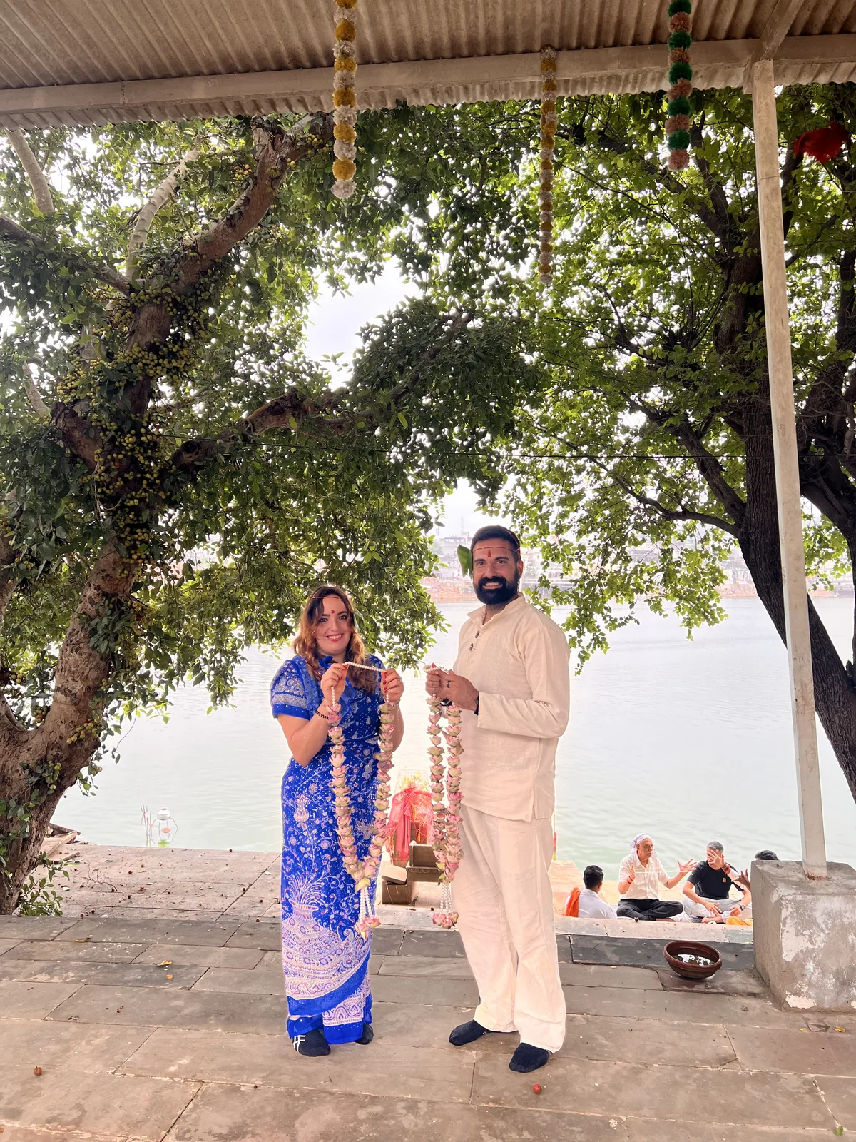 A couple pose together after a wedding ritual in Pushkar