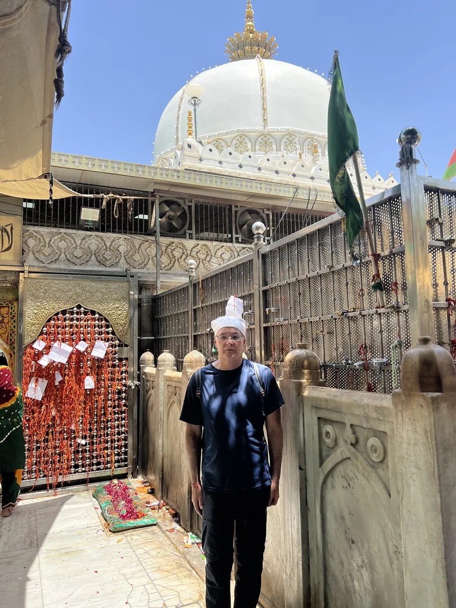 A visitor at the entrance to a sacred site in Ajmer