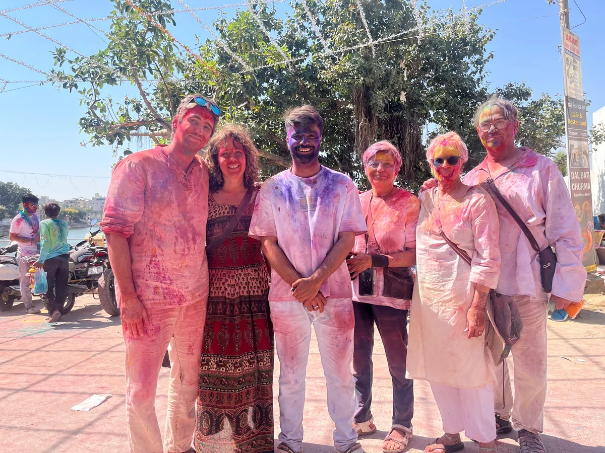 Visitors covered in colour during Holi in Pushkar